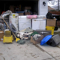 Soaked, wet personal items sitting in a driveway, including a washer and dryer in Moorpark.