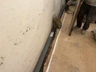 The process of removing the tile, digging and prepping it for the water guard.