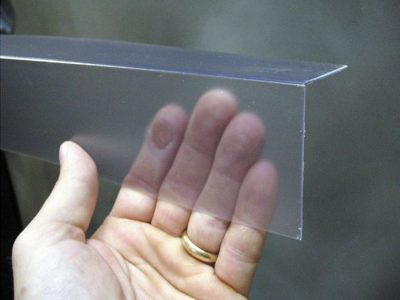 Closeup of a clear plastic covering on a Oxnard crawl space block wall