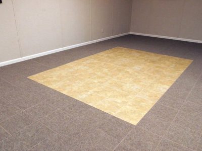 tiled and carpeted basement flooring installed in a Thousand Oaks home