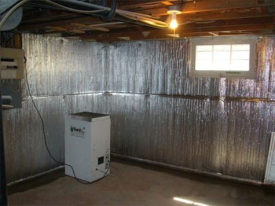 Radiant heat barrier system for unfinished basement walls